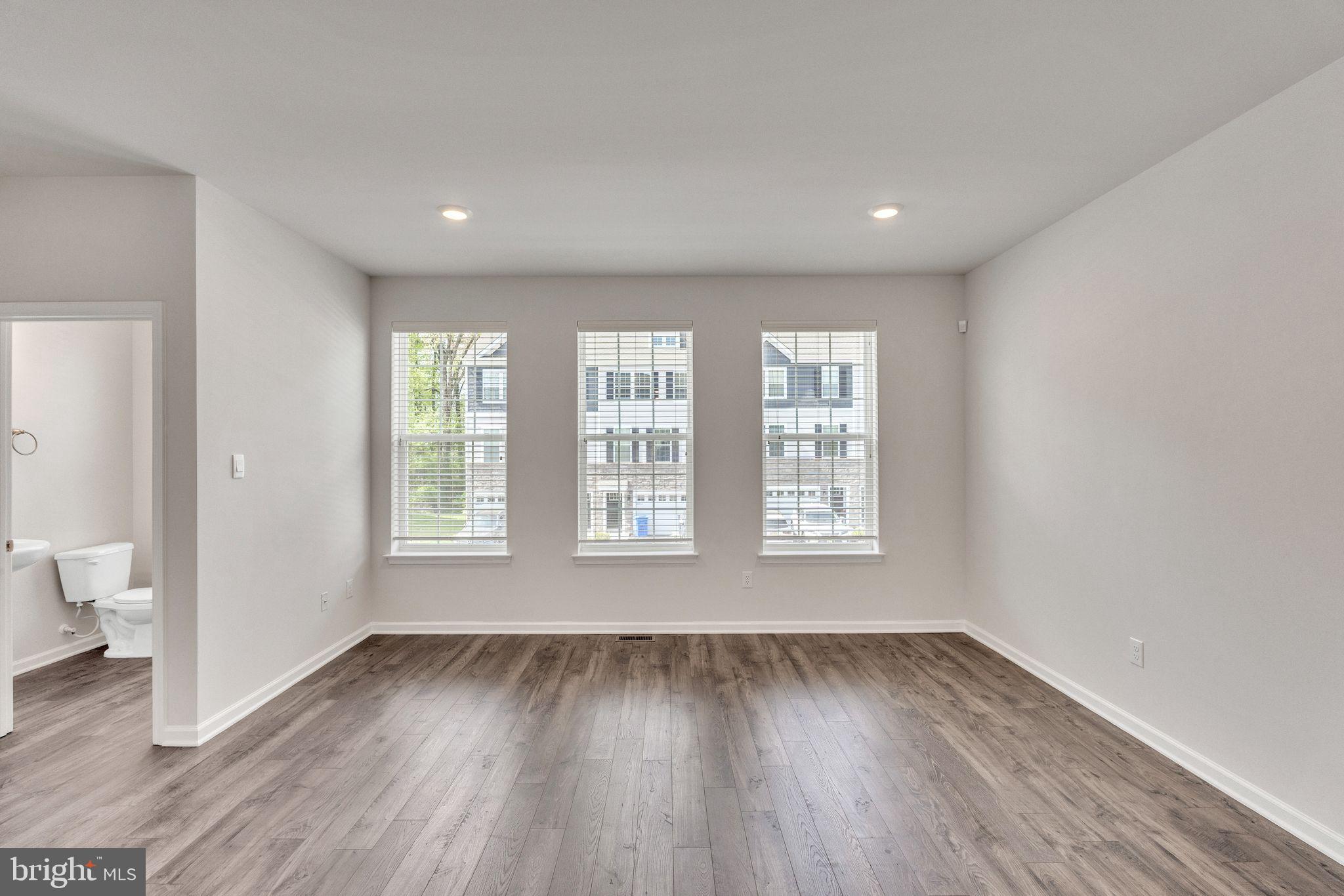 11 Lilac Circle Mount Laurel, NJ 08054 - Photo 18 of 43 a view of an empty room with wooden floor and a window