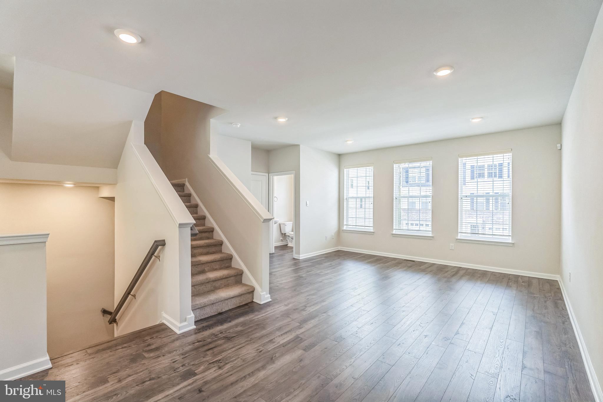 11 Lilac Circle Mount Laurel, NJ 08054 - Photo 20 of 43 a view of an empty room with wooden floor and stairs