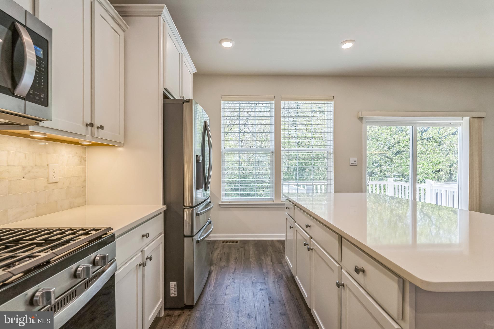 11 Lilac Circle Mount Laurel, NJ 08054 - Photo 2 of 43 a kitchen with stainless steel appliances granite countertop a stove a sink and a refrigerator