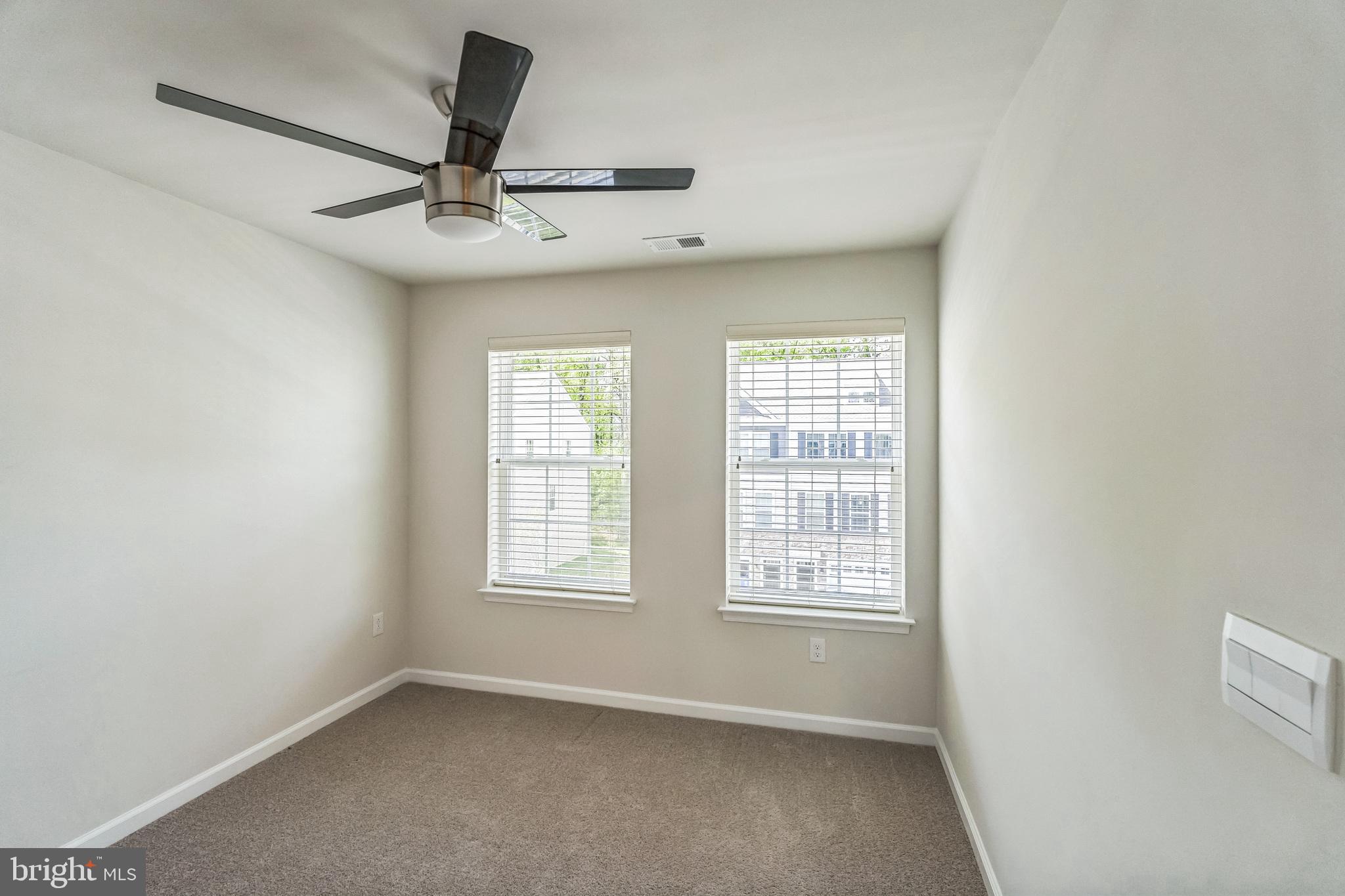 11 Lilac Circle Mount Laurel, NJ 08054 - Photo 24 of 43 an empty room with windows and fan