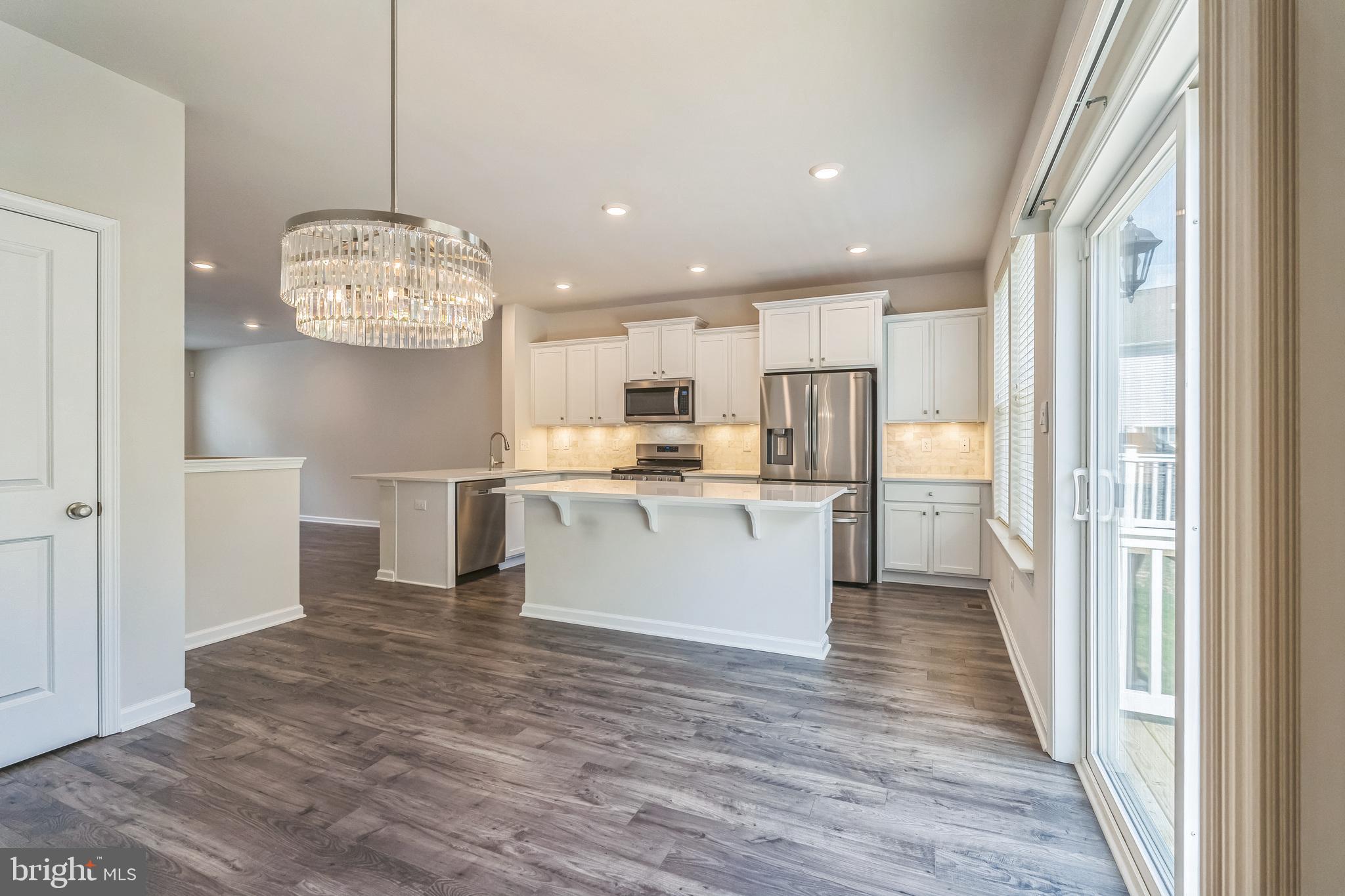 11 Lilac Circle Mount Laurel, NJ 08054 - Photo 4 of 43 a view of large kitchen with granite countertop kitchen island white cabinetry and stainless steel appliances