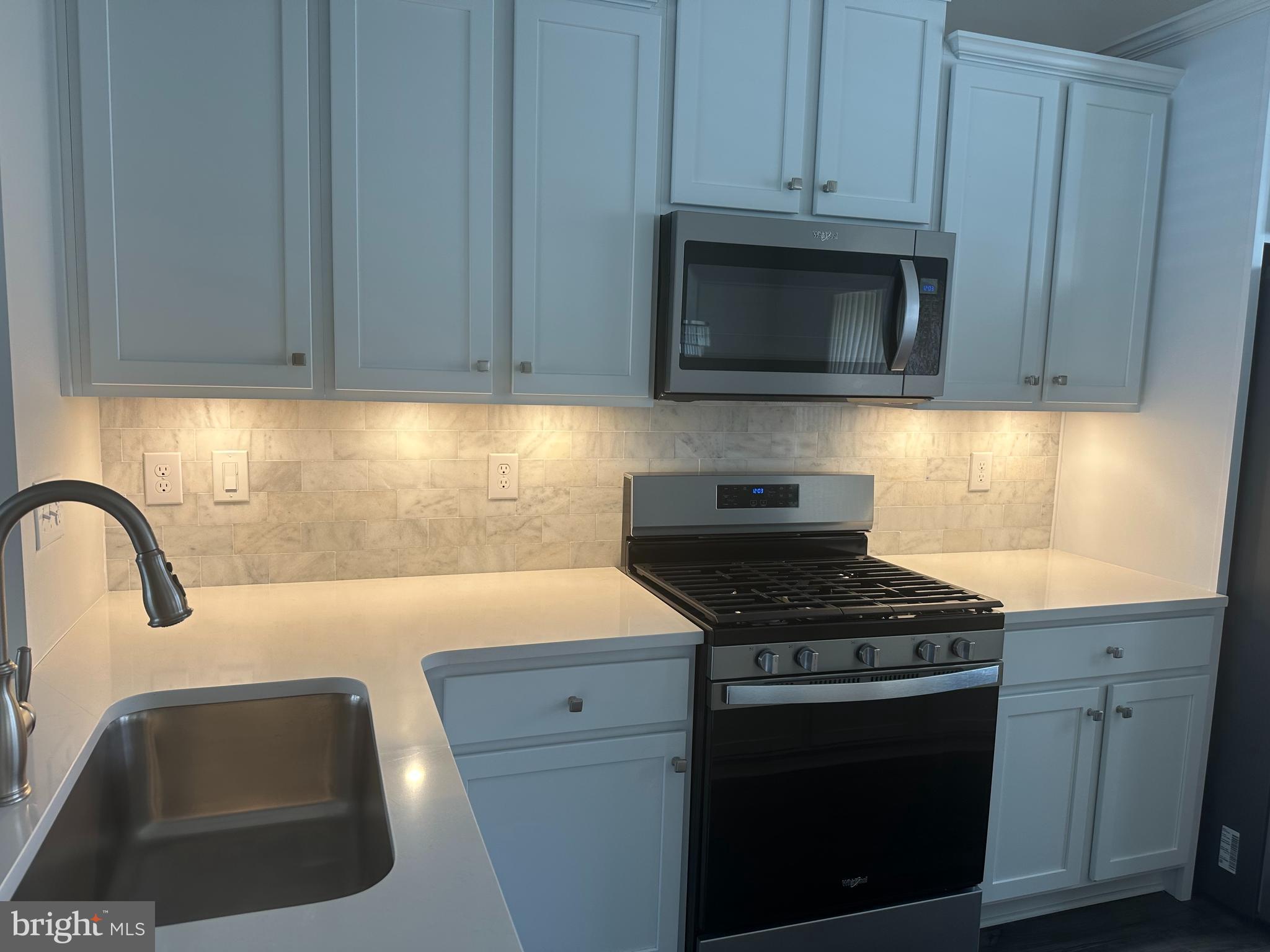 11 Lilac Circle Mount Laurel, NJ 08054 - Photo 6 of 43 a kitchen with granite countertop a stove and a sink