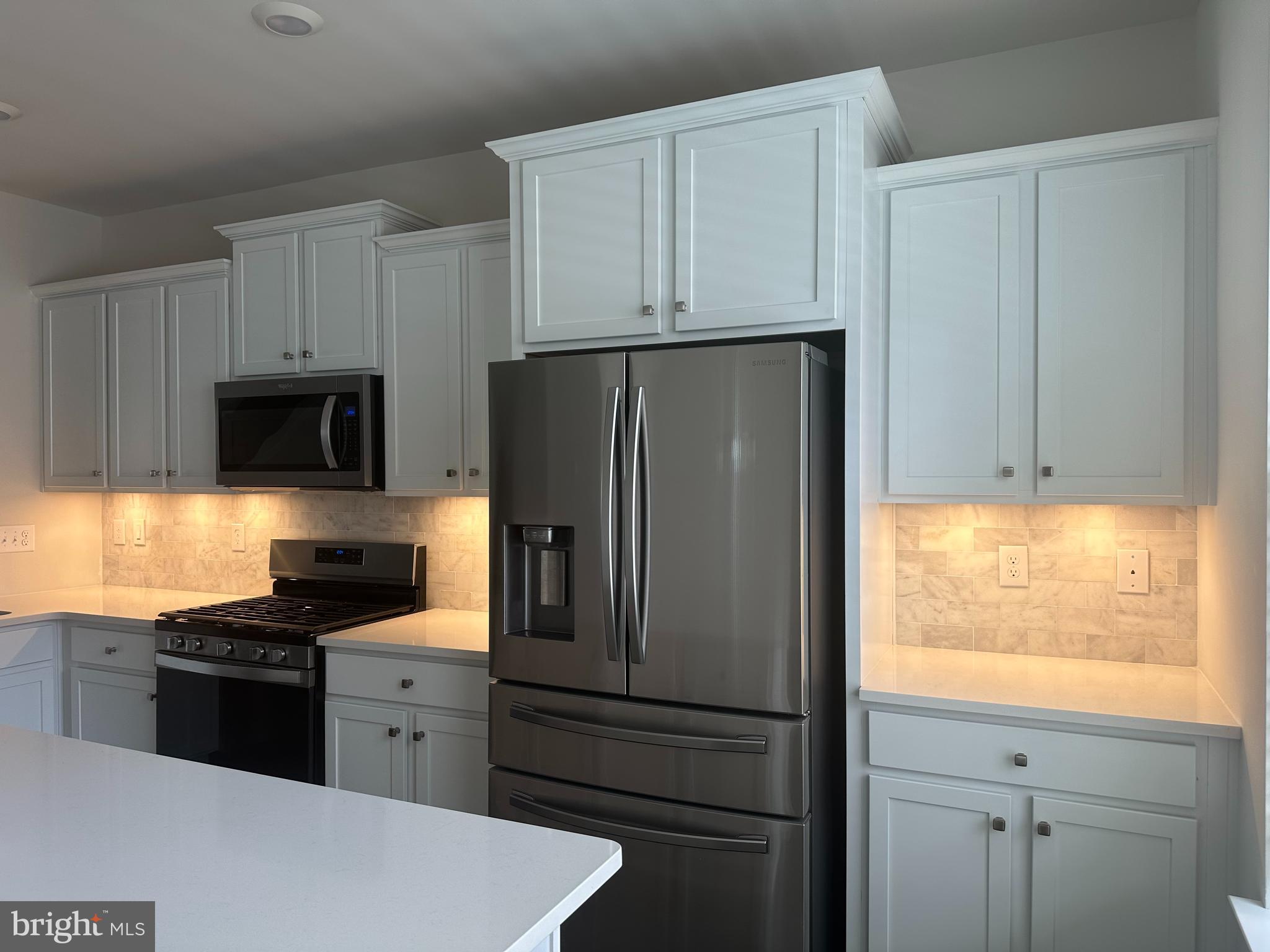 11 Lilac Circle Mount Laurel, NJ 08054 - Photo 7 of 43 a kitchen with granite countertop white cabinets and refrigerator