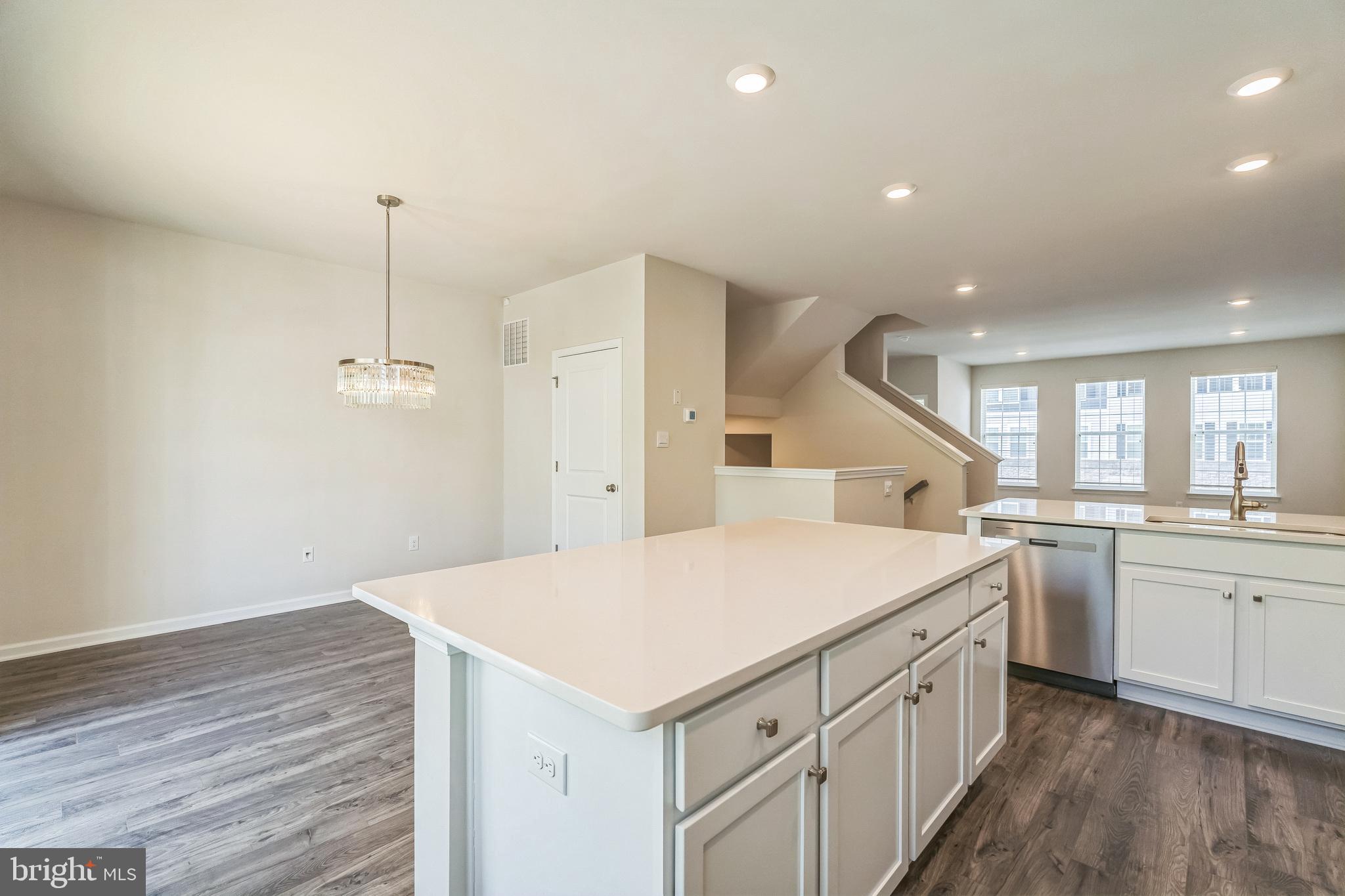 11 Lilac Circle Mount Laurel, NJ 08054 - Photo 9 of 43 a kitchen with a sink dishwasher a stove and a refrigerator with wooden floor