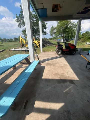 a view of swimming pool with a patio