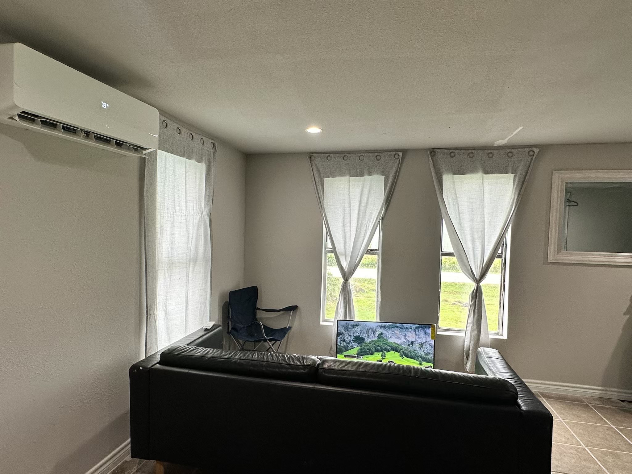 2125 Fairway Drive Angleton, TX 77515 - Photo 9 of 13 a room with two window and a bed