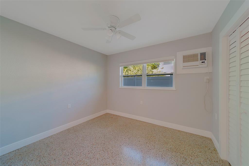 13248 4th Street East, Unit A Madeira Beach, FL 33708 - Photo 19 of 54 an empty room with windows