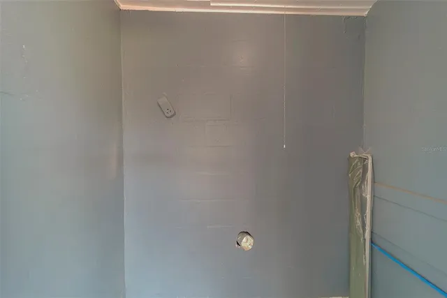 a view of a pathway of a house with wooden fence