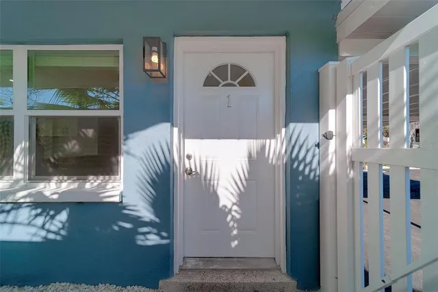 a view of a pathway of a house with plants