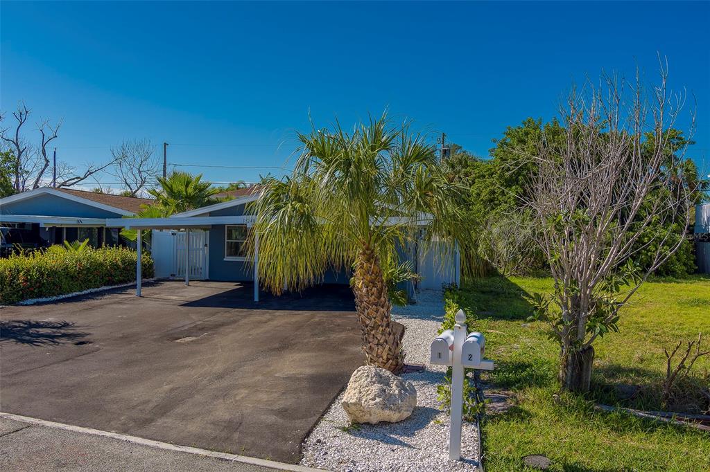 13248 4th Street East, Unit A Madeira Beach, FL 33708 - Photo 32 of 54 a view of a house with backyard and sitting area
