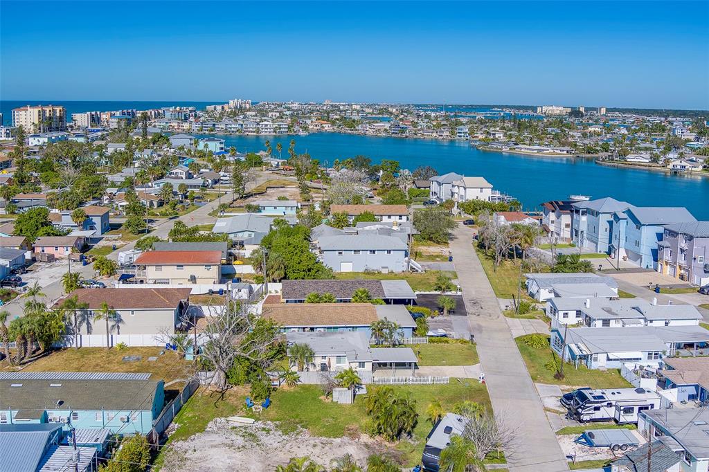 13248 4th Street East, Unit A Madeira Beach, FL 33708 - Photo 42 of 54 an aerial view of a city with lots of residential buildings ocean and mountain view in back