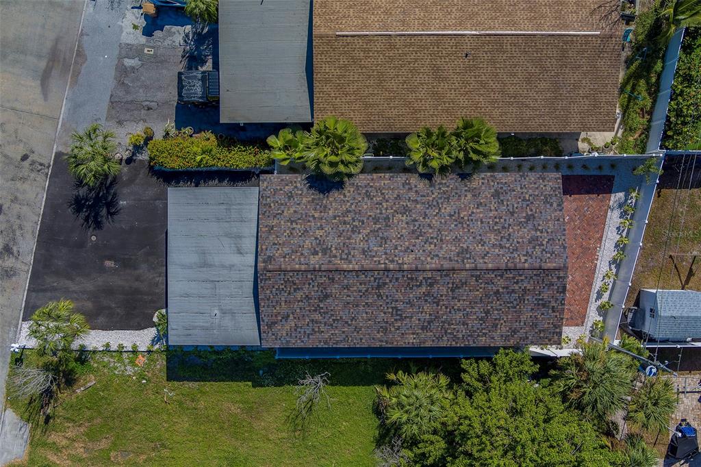 13248 4th Street East, Unit A Madeira Beach, FL 33708 - Photo 54 of 54 a brick building with a yard