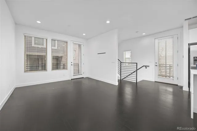a view of a balcony with two chairs