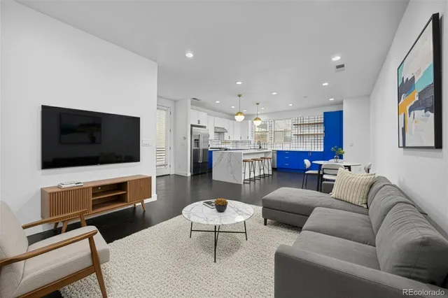 a view of a kitchen with a sink and a refrigerator