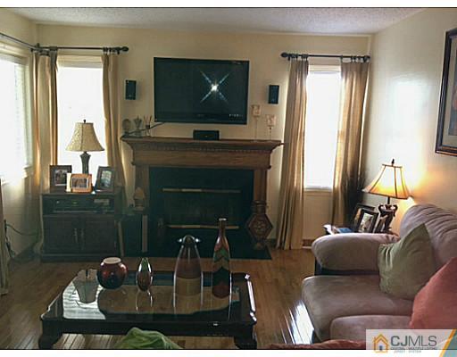 221 Edpas Road New Brunswick, NJ 08901 - Photo 3 of 18 a living room with furniture and a flat screen tv