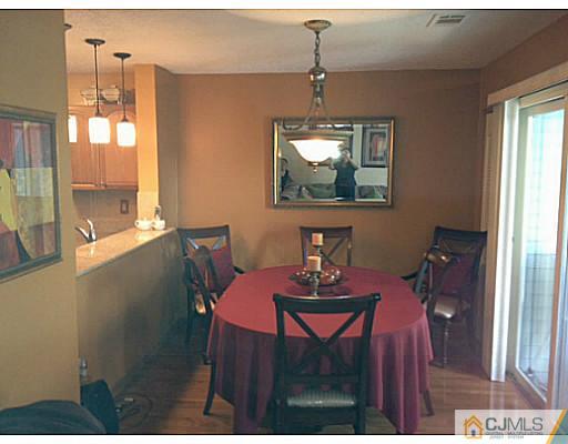 221 Edpas Road New Brunswick, NJ 08901 - Photo 4 of 18 a view of a dining room with furniture window and outside view