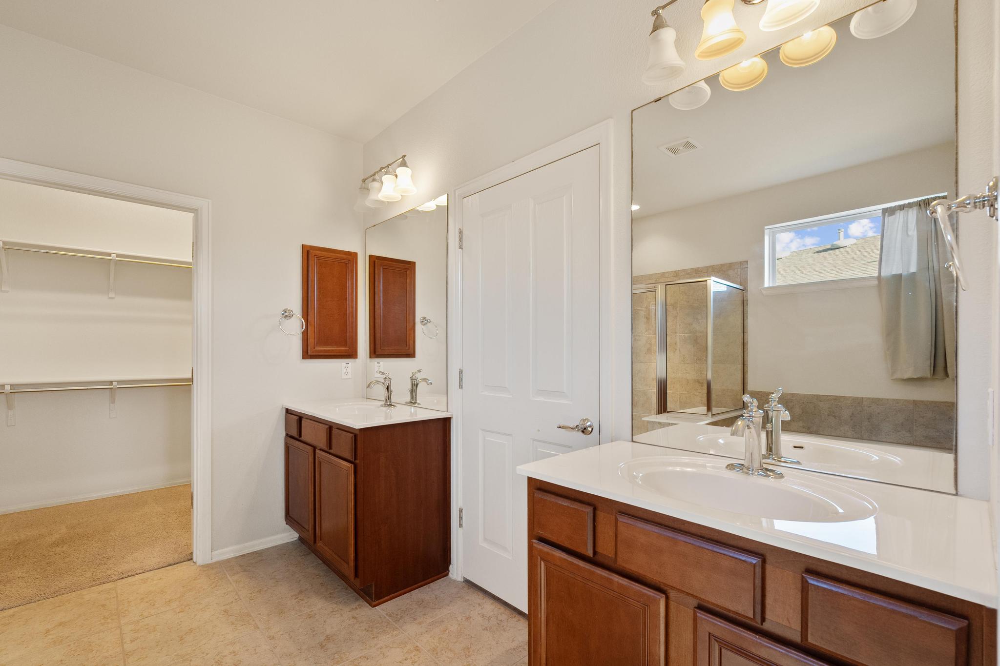 136 Prairie Creek Trail Georgetown, TX 78633 - Photo 18 of 31 a bathroom with a sink double vanity granite and a mirror
