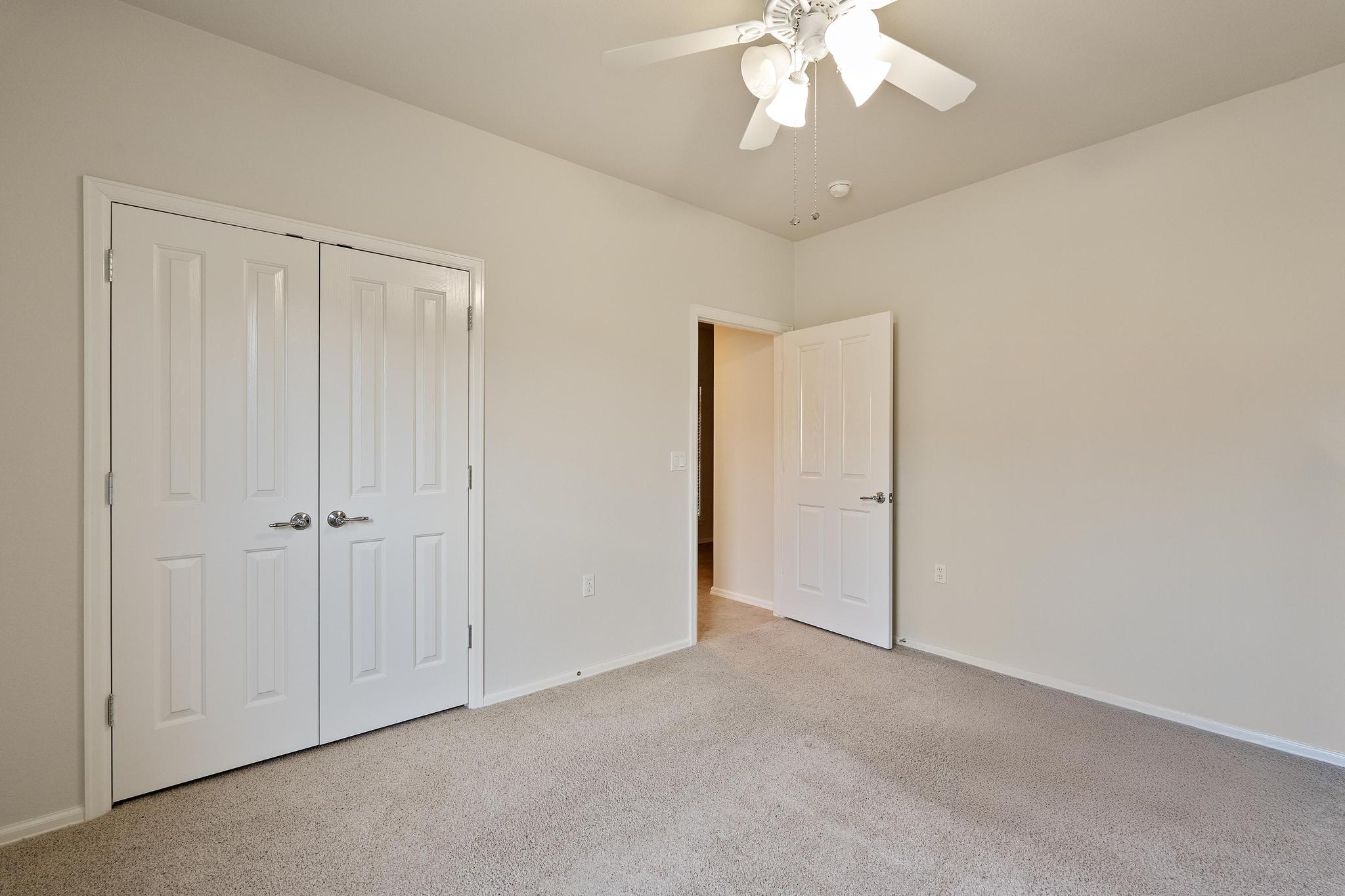 136 Prairie Creek Trail Georgetown, TX 78633 - Photo 23 of 31 a view of an empty room and chandelier fan