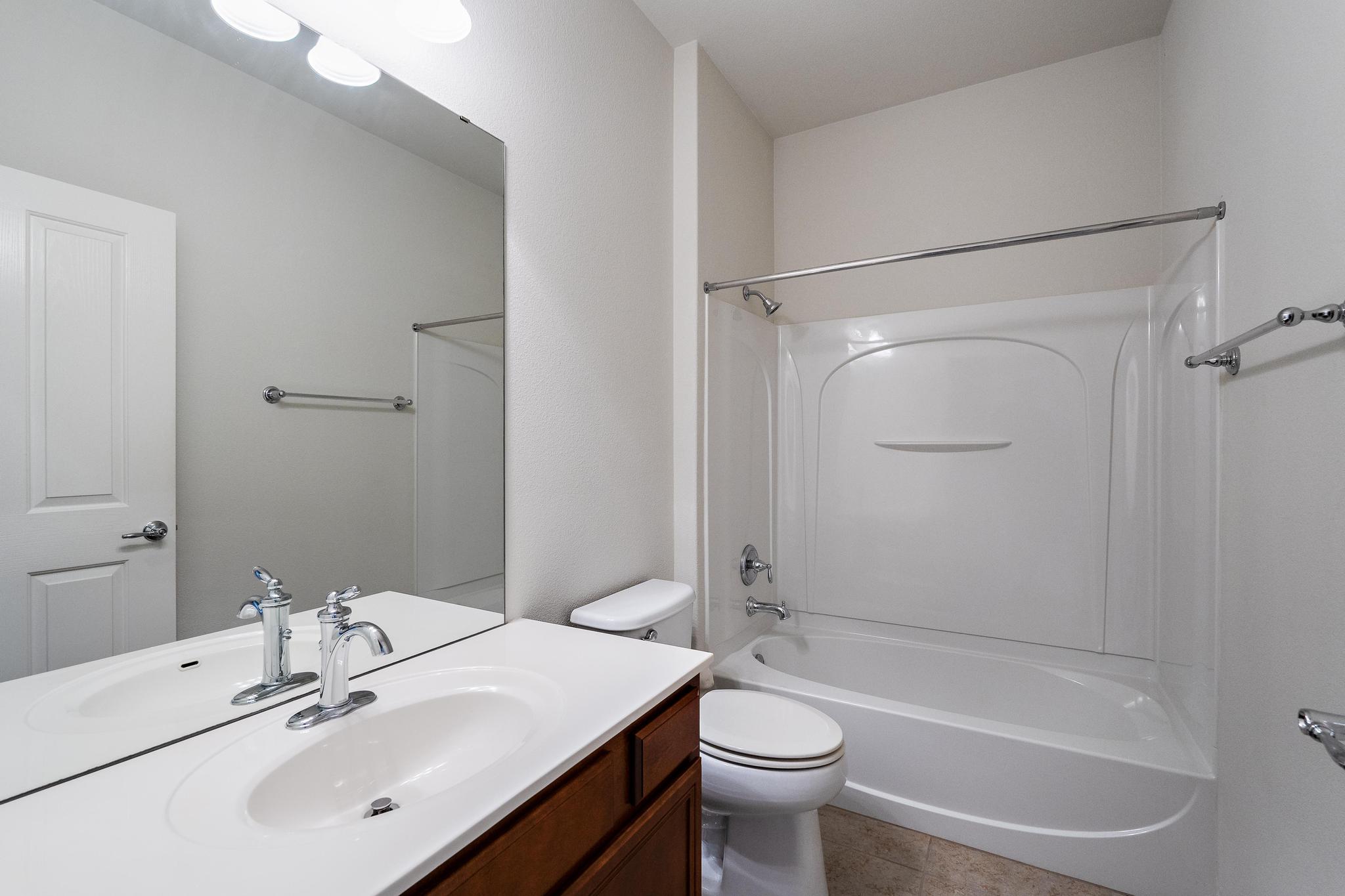 136 Prairie Creek Trail Georgetown, TX 78633 - Photo 25 of 31 a bathroom with a sink mirror toilet and bathtub