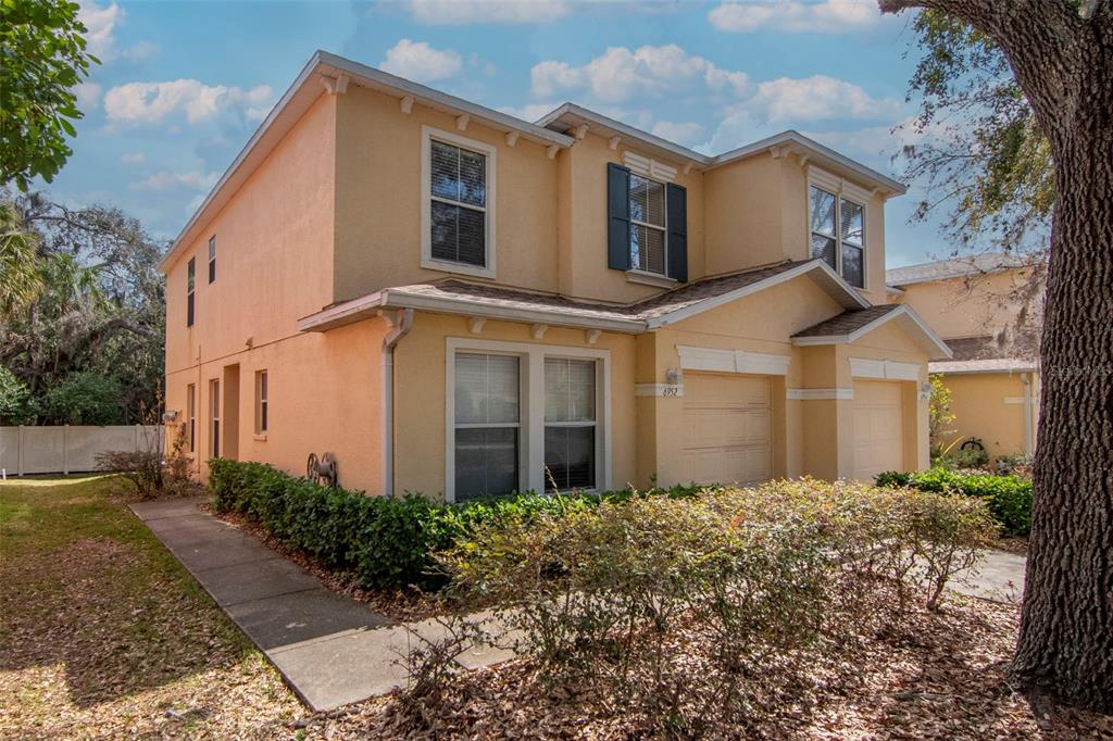 6952 Marble Fawn Place Riverview, FL 33578 - Photo 2 of 42 a front view of a house with a garden