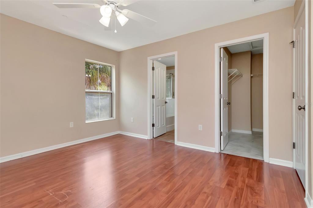 6952 Marble Fawn Place Riverview, FL 33578 - Photo 25 of 42 a view of an empty room with wooden floor and a window