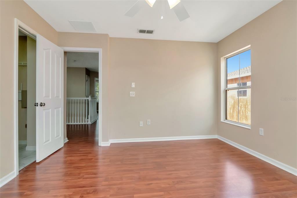 6952 Marble Fawn Place Riverview, FL 33578 - Photo 27 of 42 wooden floor in an empty room with a window