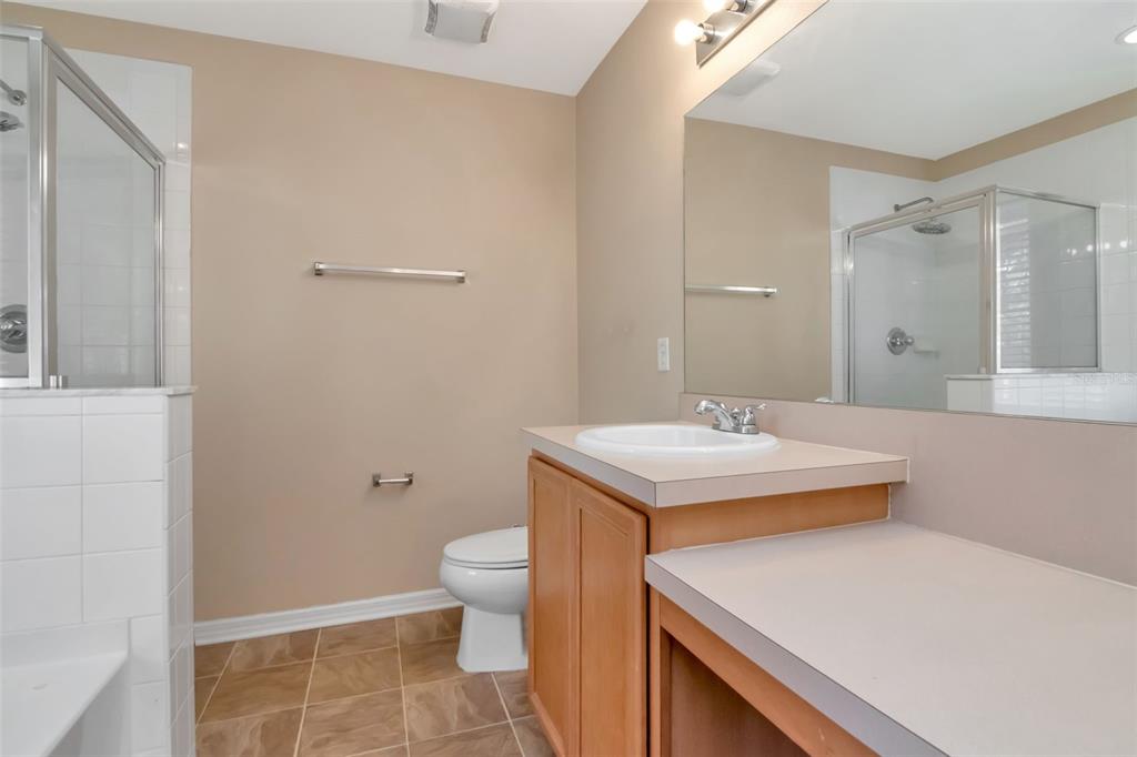 6952 Marble Fawn Place Riverview, FL 33578 - Photo 28 of 42 a bathroom with a sink a toilet and shower