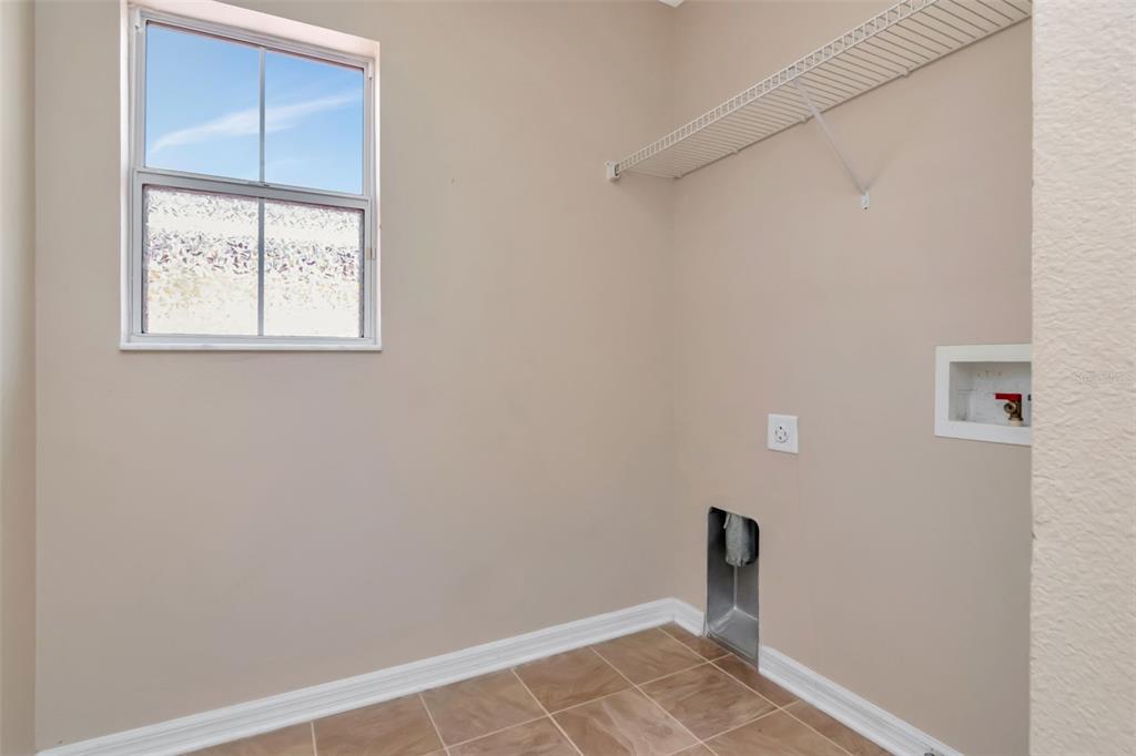 6952 Marble Fawn Place Riverview, FL 33578 - Photo 30 of 42 a view of an empty room with a window