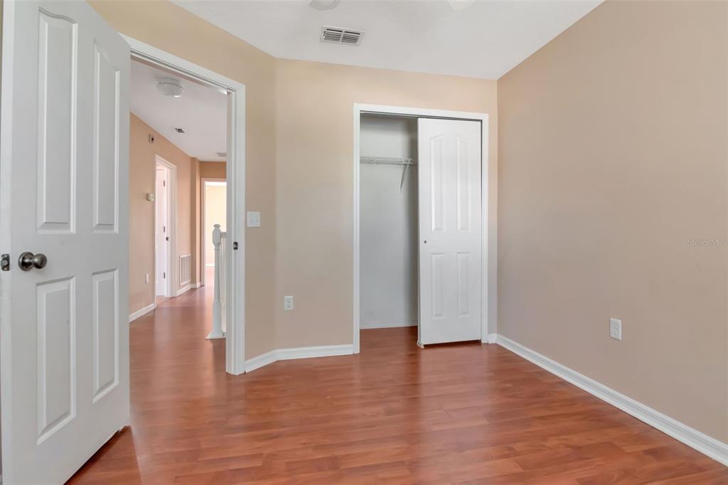 6952 Marble Fawn Place Riverview, FL 33578 - Photo 35 of 42 a view of a hallway with wooden floor