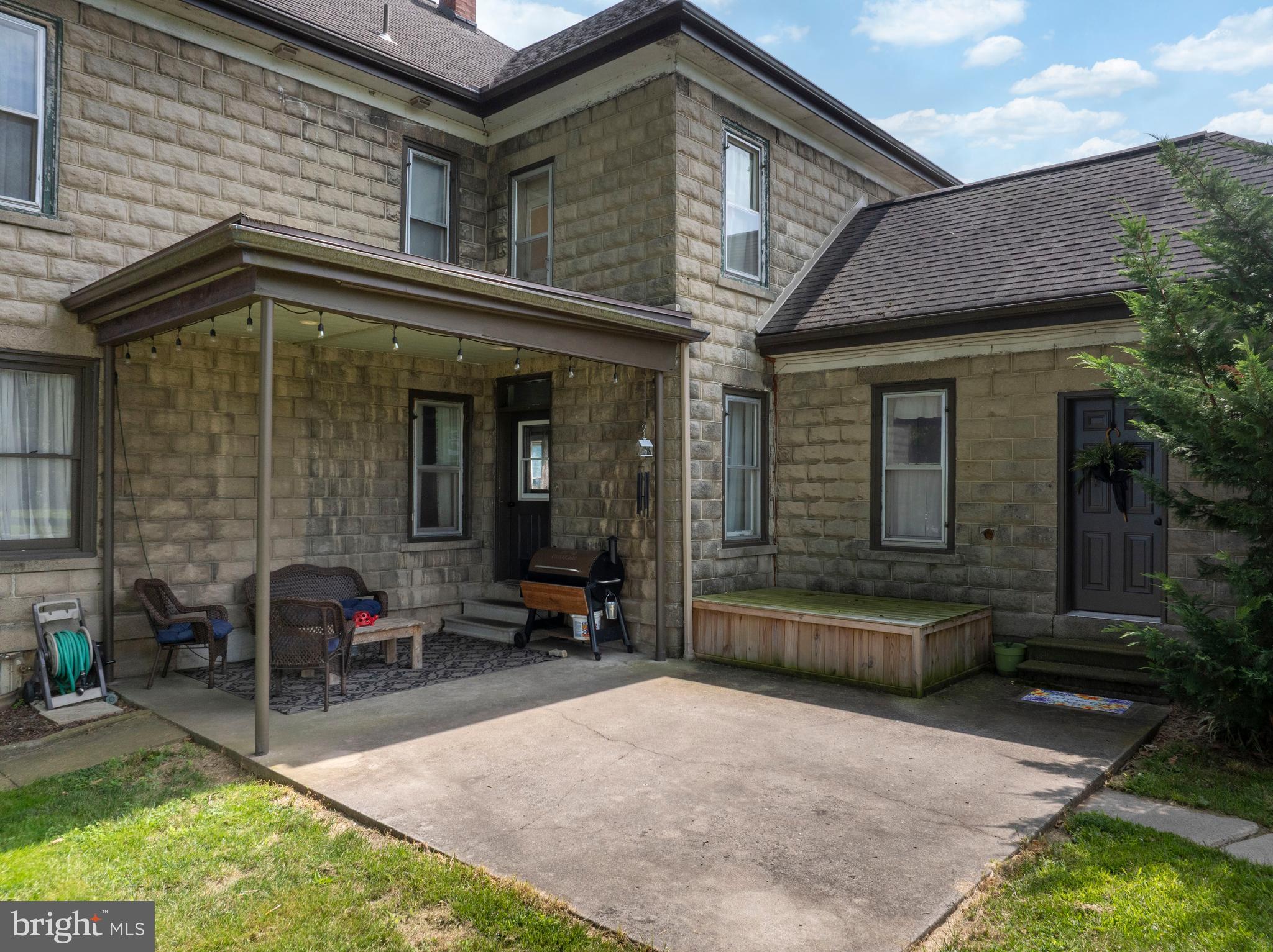 Covered patio and covered access to basement