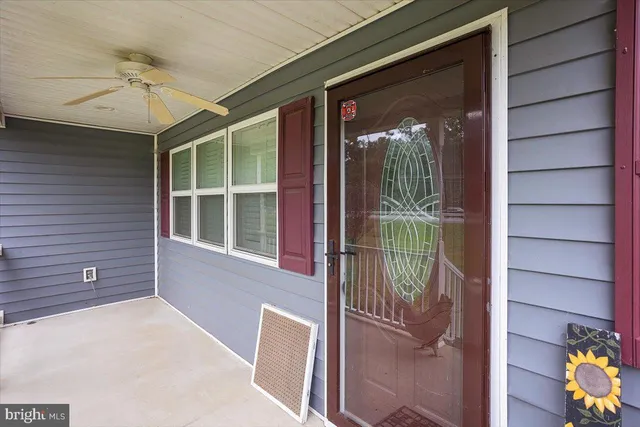 a view of a door with a glass door and wooden floor