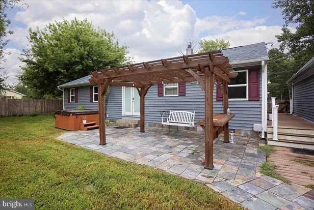 a front view of house with a garden