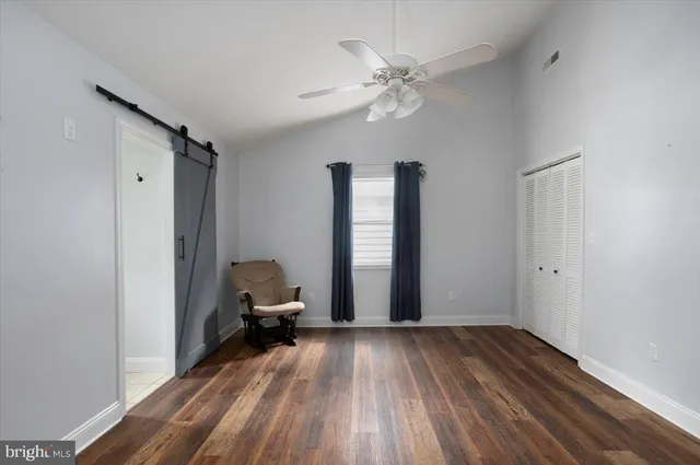 a view of a livingroom with wooden floor