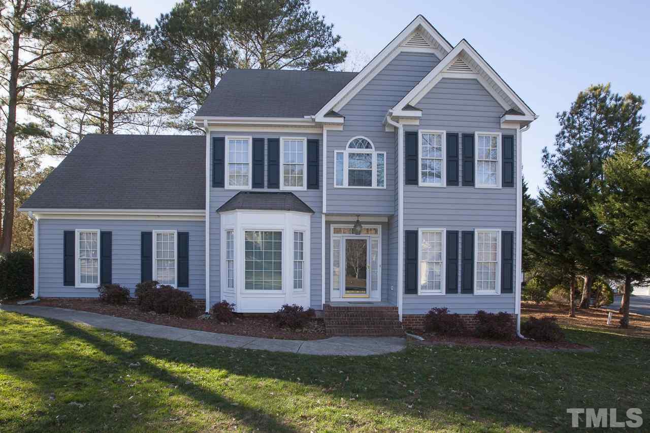 6805 Wilderness Road Raleigh, NC 27613 - Photo 1 of 25 front view of a house with a yard