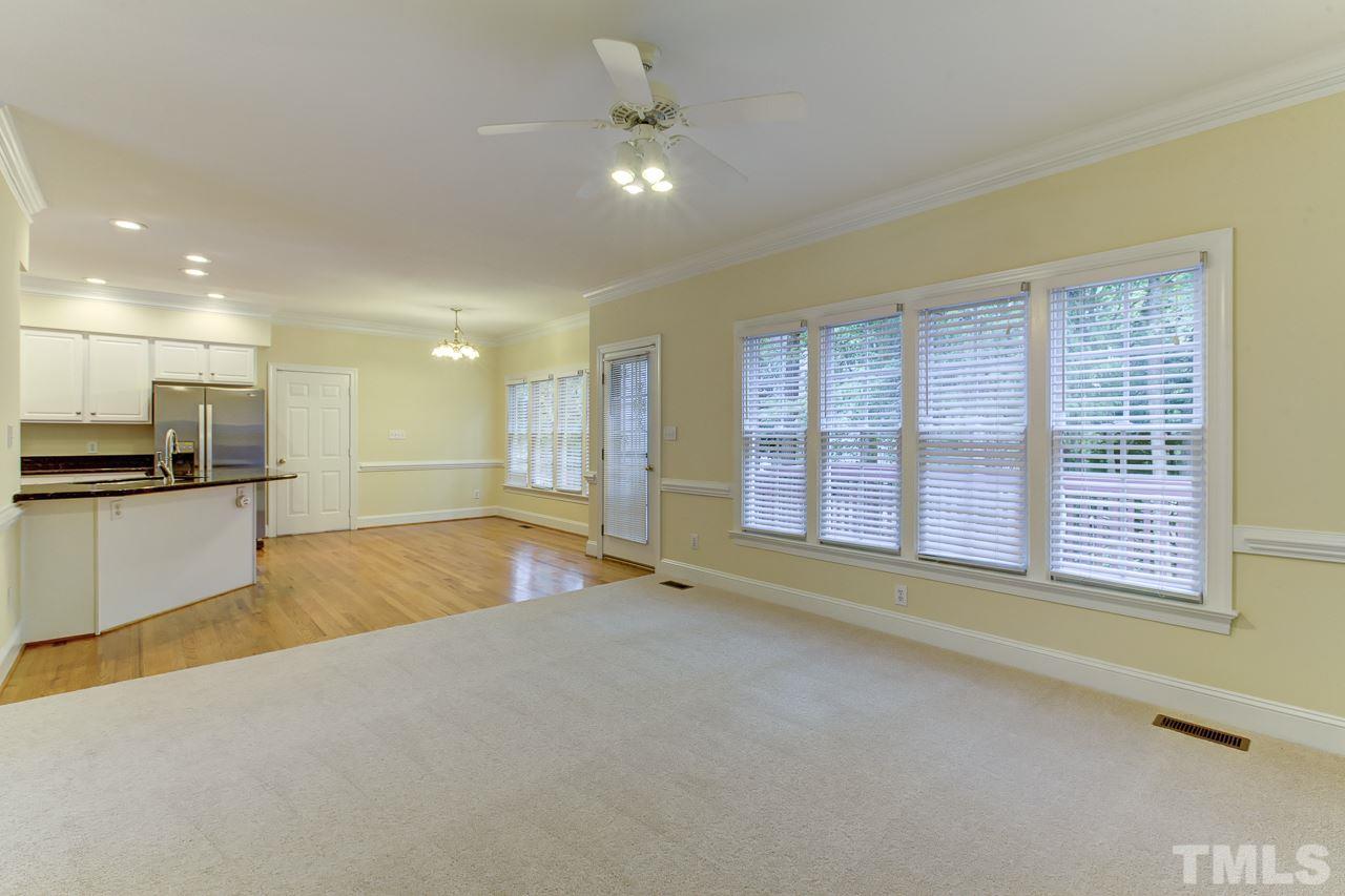 6805 Wilderness Road Raleigh, NC 27613 - Photo 11 of 25 a view of an empty room with a kitchen stove and a window