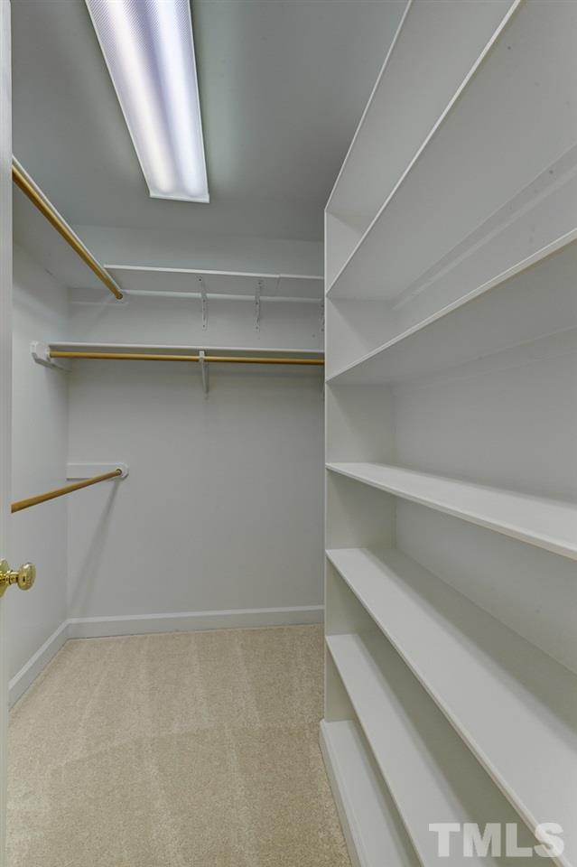 6805 Wilderness Road Raleigh, NC 27613 - Photo 16 of 25 a view of an empty walk in closet