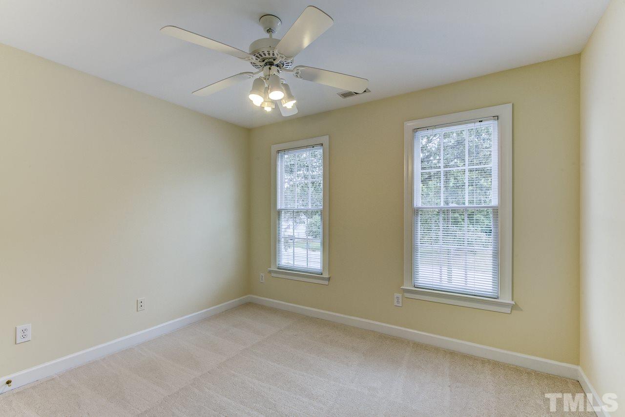 6805 Wilderness Road Raleigh, NC 27613 - Photo 17 of 25 a view of an empty room with a window