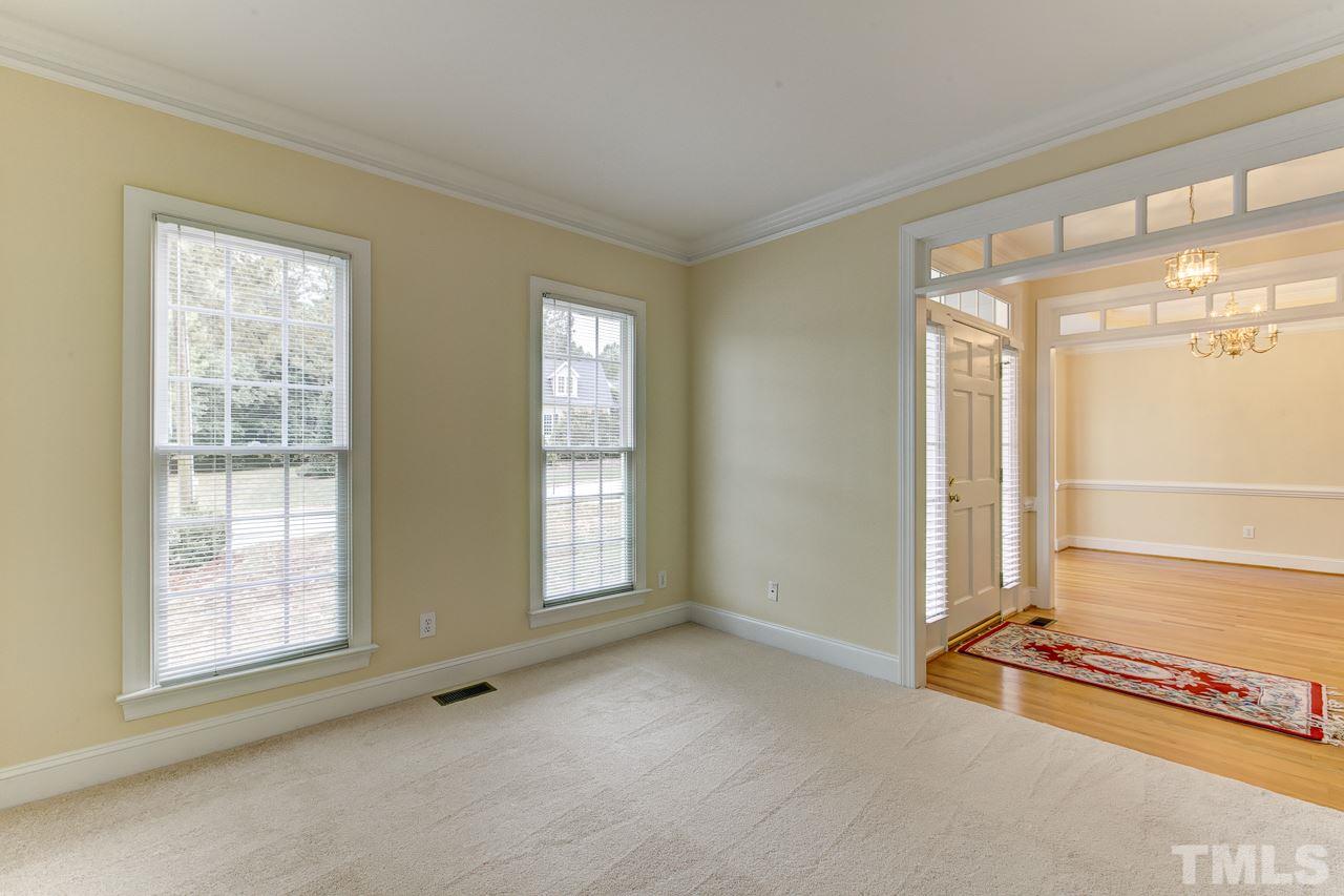 6805 Wilderness Road Raleigh, NC 27613 - Photo 3 of 25 an empty room with windows