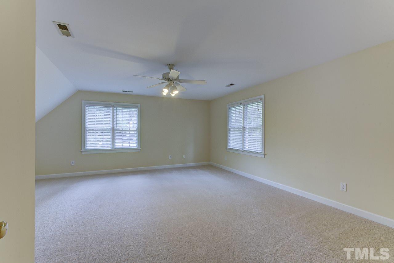 6805 Wilderness Road Raleigh, NC 27613 - Photo 21 of 25 an empty room with a window