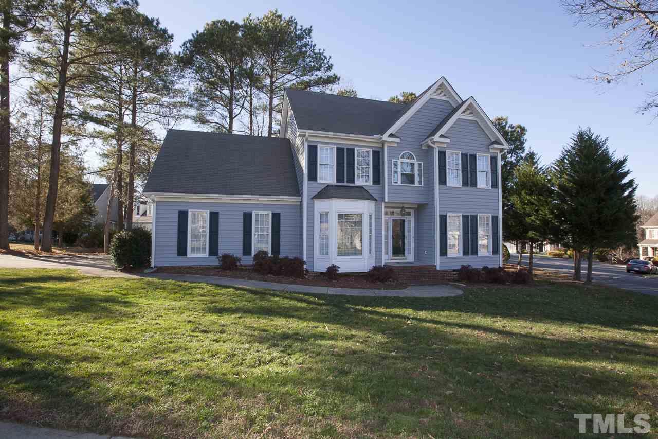6805 Wilderness Road Raleigh, NC 27613 - Photo 25 of 25 a front view of a house with a yard porch and outdoor seating