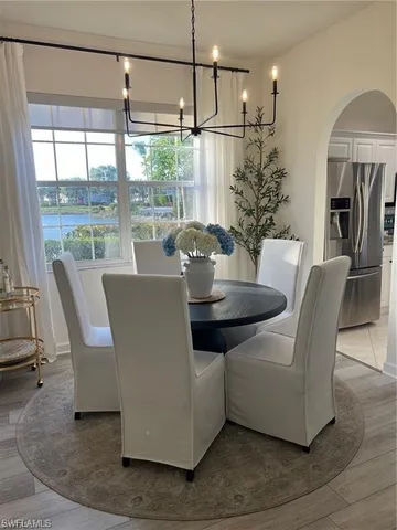 a view of a dining room with furniture window and outside view