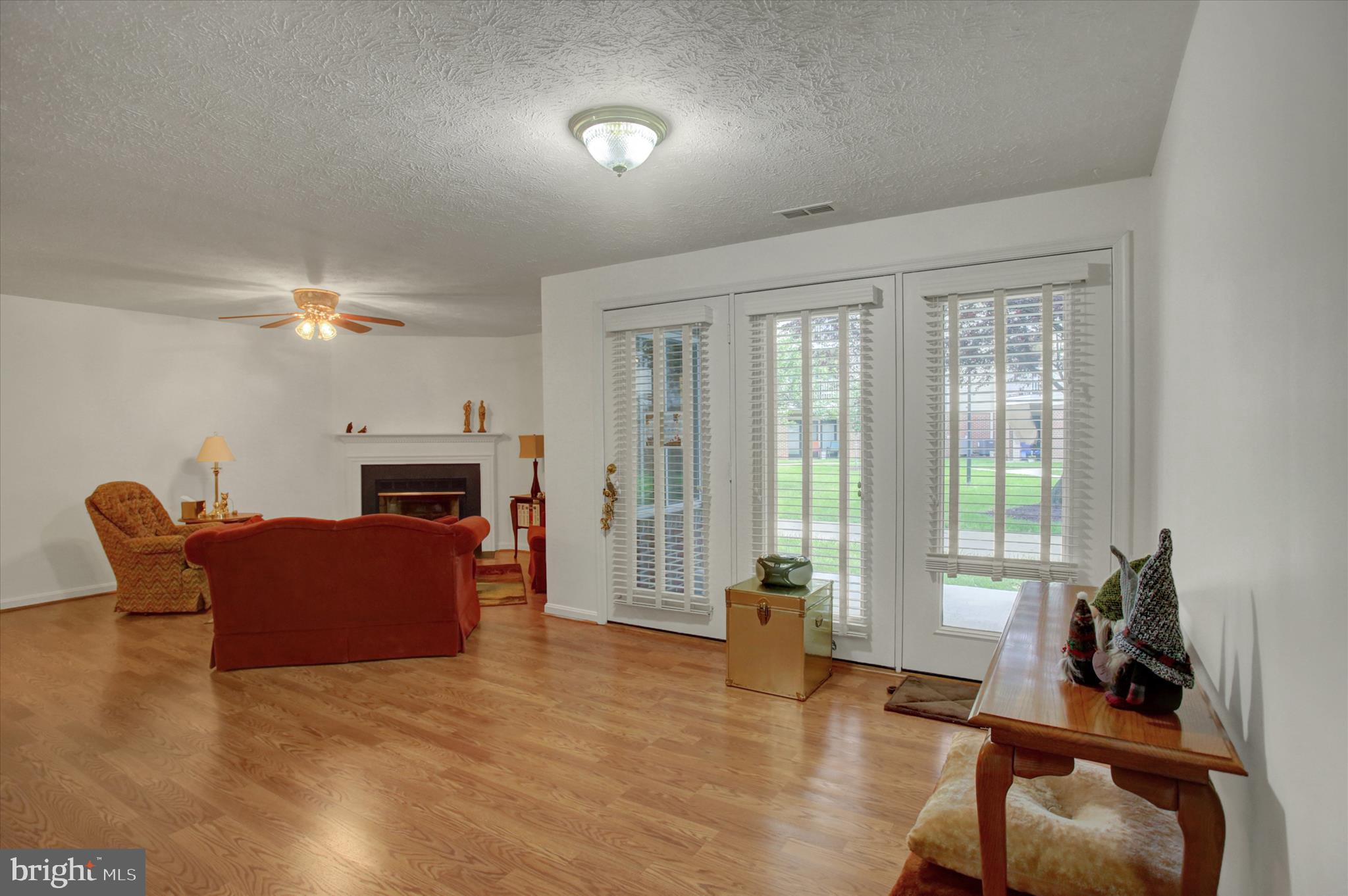 2108 Whitehall Road, Unit BC Frederick, MD 21702 - Photo 7 of 35 a living room with furniture a flat screen tv and a large window