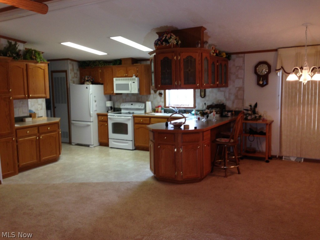 101 Morges Road Malvern, OH 44644 - Photo 5 of 18 Open Kitchen and dining area with plenty of cabinets