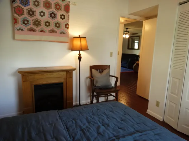 a view of room with furniture and wooden floor