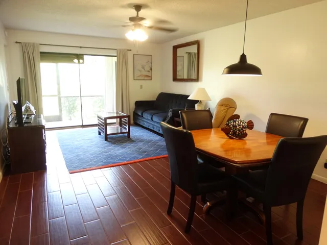 a view of a dining room with furniture window and outside view