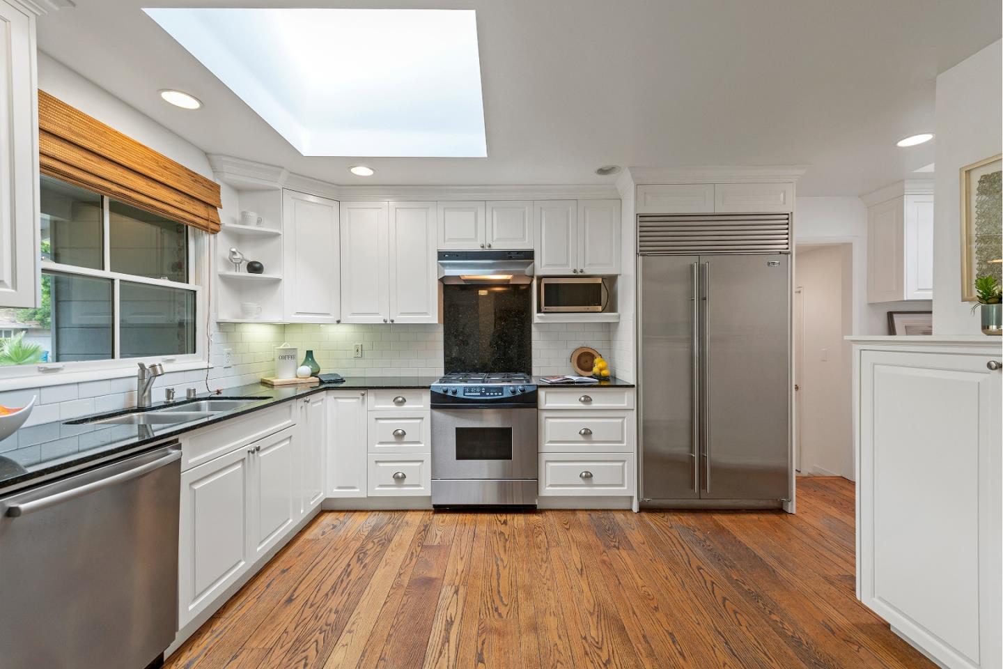 1340 Hillview Drive Menlo Park, CA 94025 - Photo 12 of 29 a kitchen with stainless steel appliances a stove sink and refrigerator