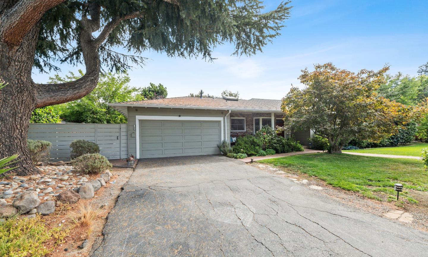 1340 Hillview Drive Menlo Park, CA 94025 - Photo 2 of 29 a front view of a house with a yard and garage