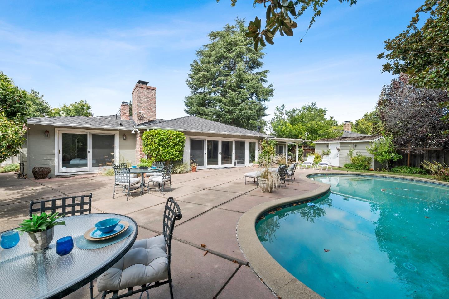 1340 Hillview Drive Menlo Park, CA 94025 - Photo 27 of 29 a view of a house with backyard sitting area and swimming pool