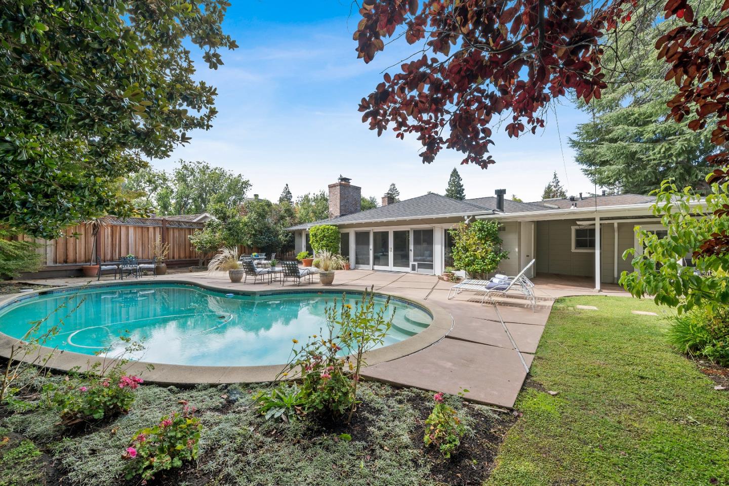 1340 Hillview Drive Menlo Park, CA 94025 - Photo 28 of 29 front view of a house with a yard table and chairs