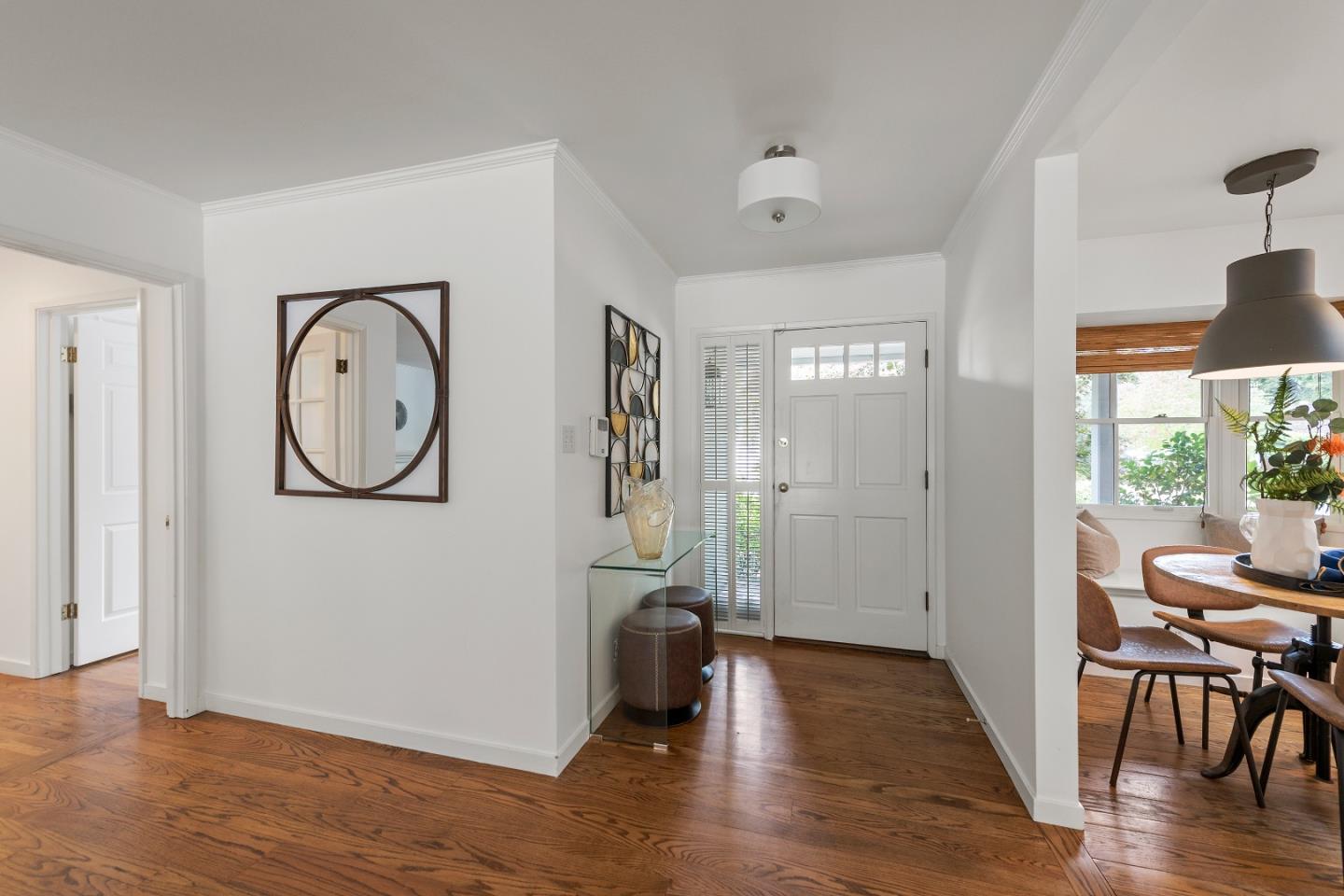 1340 Hillview Drive Menlo Park, CA 94025 - Photo 5 of 29 a view of a hallway with wooden floor and a dining space